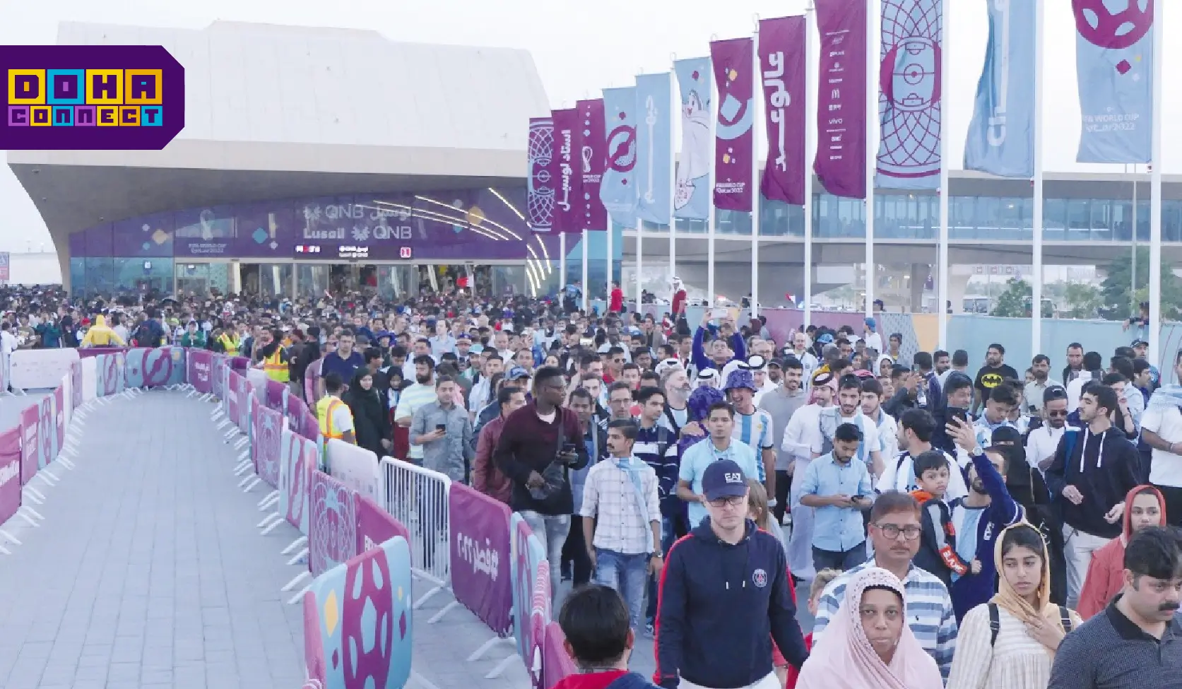 Doha Metro passengers standing on platform, following safety guidelines, keeping distance from train doors.